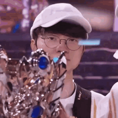 Man With Glasses And Hat Holding Trophy GIF