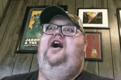 Man With Glasses And Hat Making Funny Face GIF