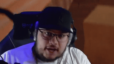 Man With Glasses And Hat Sitting In Chair With Headphones GIF