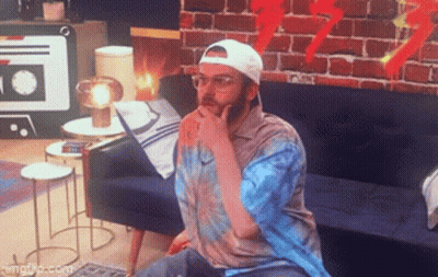 Man With Glasses And Hat Sitting On Couch GIF
