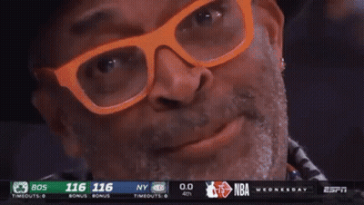 Man With Glasses And Hat Smiling At Basketball Game GIF