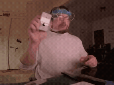 Man With Glasses And Headband Holding Camera GIF