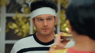 Man With Glasses And Headband Looking At Woman GIF