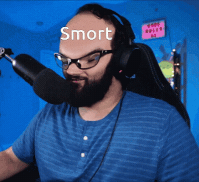 Man With Glasses and Headphones at Microphone Saying Smort