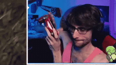 Man With Glasses And Headphones Holding Red Controller GIF