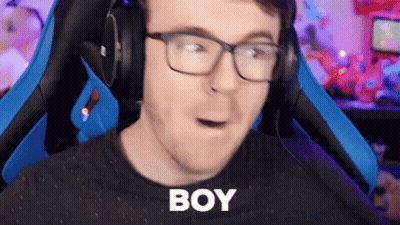 Man With Glasses And Headphones In Gaming Chair Making Funny Face GIF