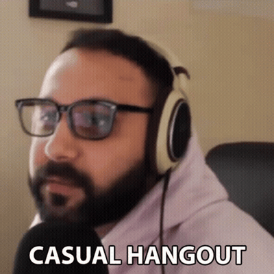 Man With Glasses And Headphones In Pink Hoodie Says Casual Hangout GIF