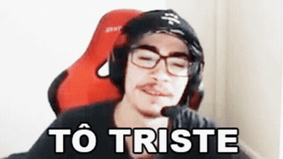 Man With Glasses And Headphones In Red Chair To Triste GIF