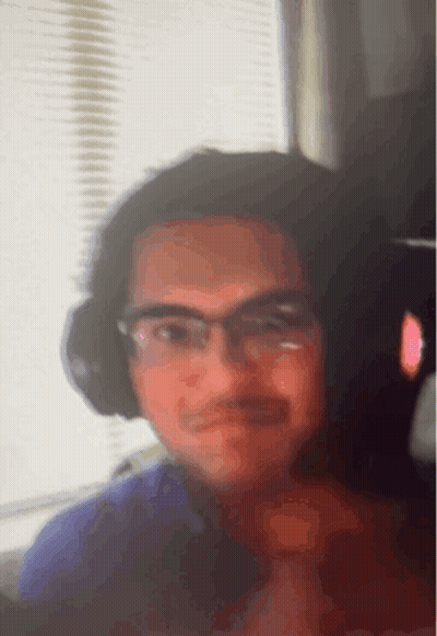 Man With Glasses And Headphones Looking At Camera GIF