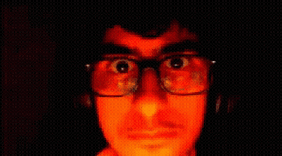 Man With Glasses And Headphones Making Funny Face Moscow GIF