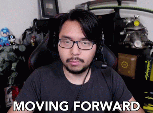Man With Glasses And Headphones Saying Moving Forward GIF