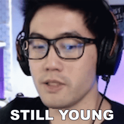 Man With Glasses And Headphones Saying Still Young GIF