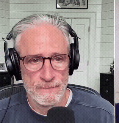 Man With Glasses And Headphones Talks Into Microphone GIF