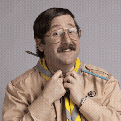 Hombre con gafas y bigote sosteniendo bolígrafo GIF