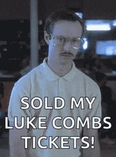 Man With Glasses And Mustache Holding Sign Sold My Luke Combs Tickets GIF