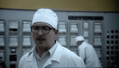 Man With Glasses and Mustache in Lab Coat