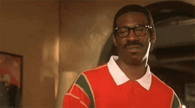 Man With Glasses And Mustache In Red And Green Sweater GIF