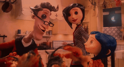 Man With Glasses And Mustache Next To Two Dolls GIF