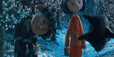 Man With Glasses And Mustache Next To Two Dolls GIF