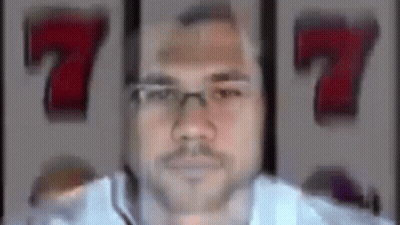 Man With Glasses And Mustache Winning Slot Machine Jackpot GIF
