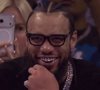 Man With Glasses And Necklace Smiling Selfie GIF