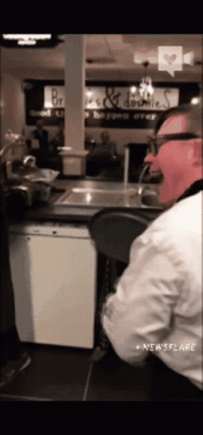 Man With Glasses And Pink Mask At Counter GIF