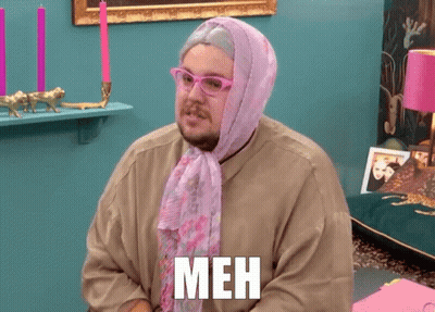 Man With Glasses And Pink Scarf Saying Meh On Shirt GIF