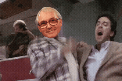 Man With Glasses and Plaid Shirt Dancing With Another Man