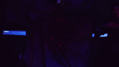 Man With Glasses And Red Shirt Holding Flag GIF