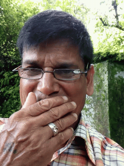 Man With Glasses And Ring Holding Hand To Mouth GIF