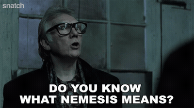 Man With Glasses And Scarf Saying Do You Know What Nemesis Means GIF