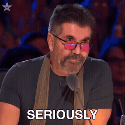 Man With Glasses And Scarf Speaking Seriously GIF