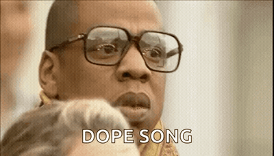 Man With Glasses And Scarf Talking To Woman GIF