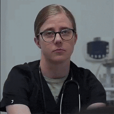 Man With Glasses And Stethoscope Looking At Camera GIF