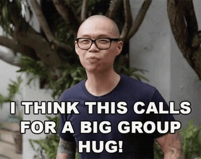 Man With Glasses And Tattoo Saying I Think This Calls For A Big Group Hug GIF