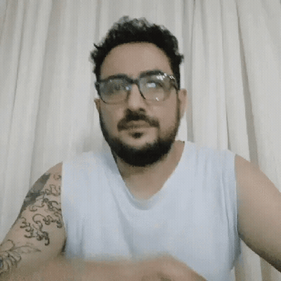 Man With Glasses And Tattoo Smiling GIF