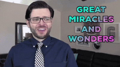 Man With Glasses And Tie Saying Great Miracles And Wonders GIF