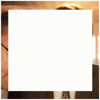 Man With Glasses And Tie Stares At Eyes Closed Man GIF