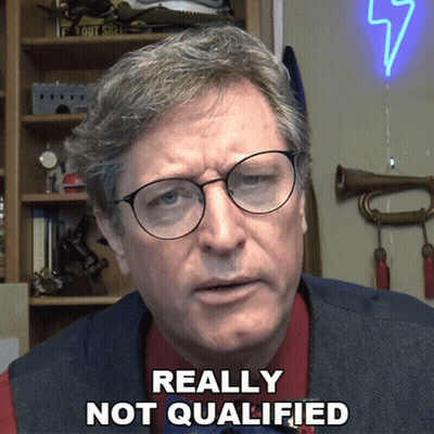 Man With Glasses And Vest Saying Really Not Qualified GIF