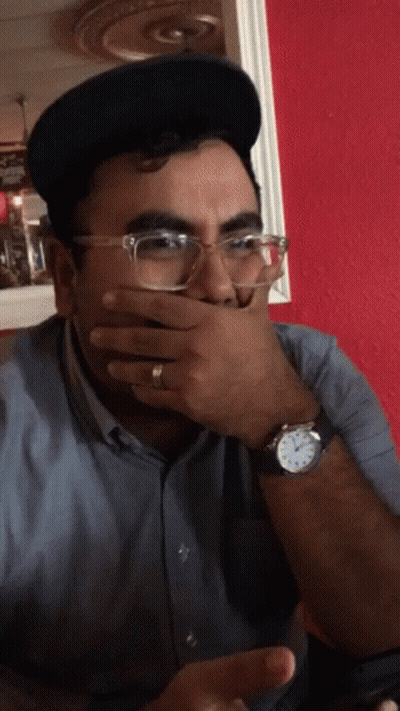 Man With Glasses And Watch Covering Mouth GIF