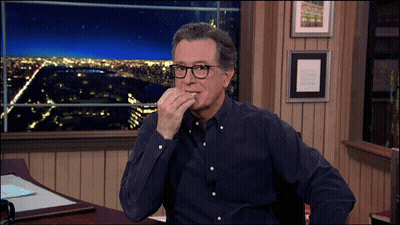 Man With Glasses At Desk Hand On Chin GIF