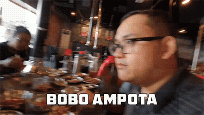 Man With Glasses At Table With Food Saying Bobo Ampota GIF