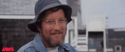 Man With Glasses Brushing Teeth Near Shark GIF