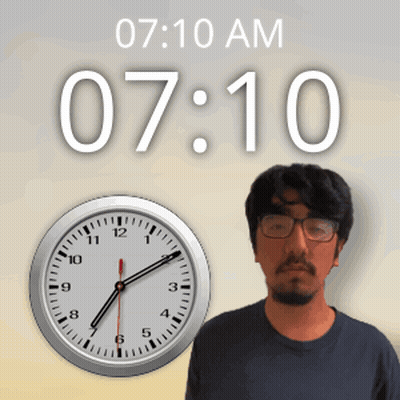 Man With Glasses By Clock Showing 7:10 AM GIF