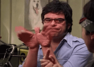 Man With Glasses Clapping Beside White Dog Picture GIF