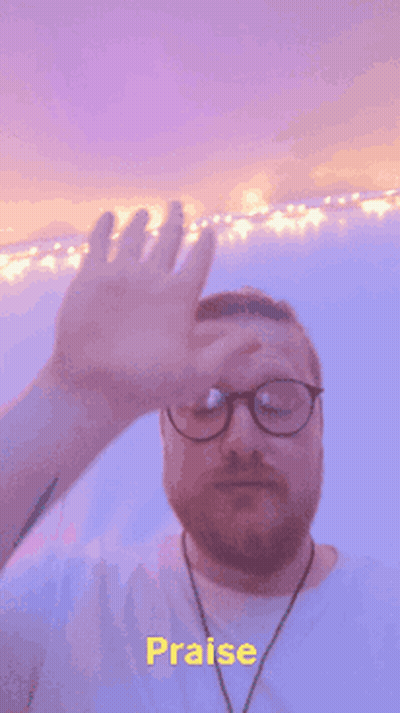 Man With Glasses Covering Face Saying Praise GIF