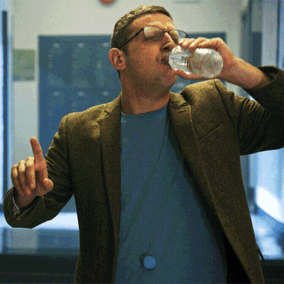 Man With Glasses Drinking From Bottle GIF