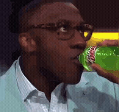 Man With Glasses Drinking Green Mountain Dew