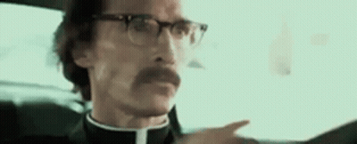 Man With Glasses Driving And Pointing GIF