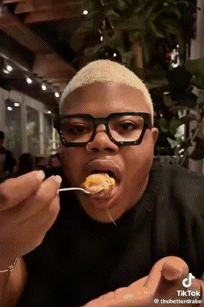 Man With Glasses Eating From Spoon GIF